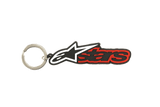 Alpinestars Blaze Key Fob, 3D rubber keychain in Black and Red, featuring the white and black star logo and red outlined text, durable metal snap ring, motorsport-inspired accessory