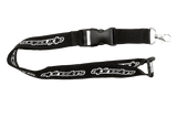 Alpinestars Core Lanyard, Black, featuring white repeating Alpinestars logo, plastic breakaway and detachable buckle, metal swivel clip, durable ribbed polyester construction for keys and ID cards