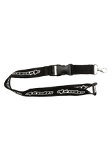 Alpinestars Core Lanyard, black sportswear lanyard featuring printed white brand logos, breakaway safety clip, and detachable metal swivel clip