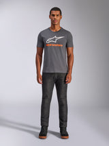 Alpinestars Always 2.0 CSF Tee, Short Sleeve T-Shirt, Charcoal Gray with White Logo and Orange Text, worn by model with dark jeans, Casual Motorsport Streetwear