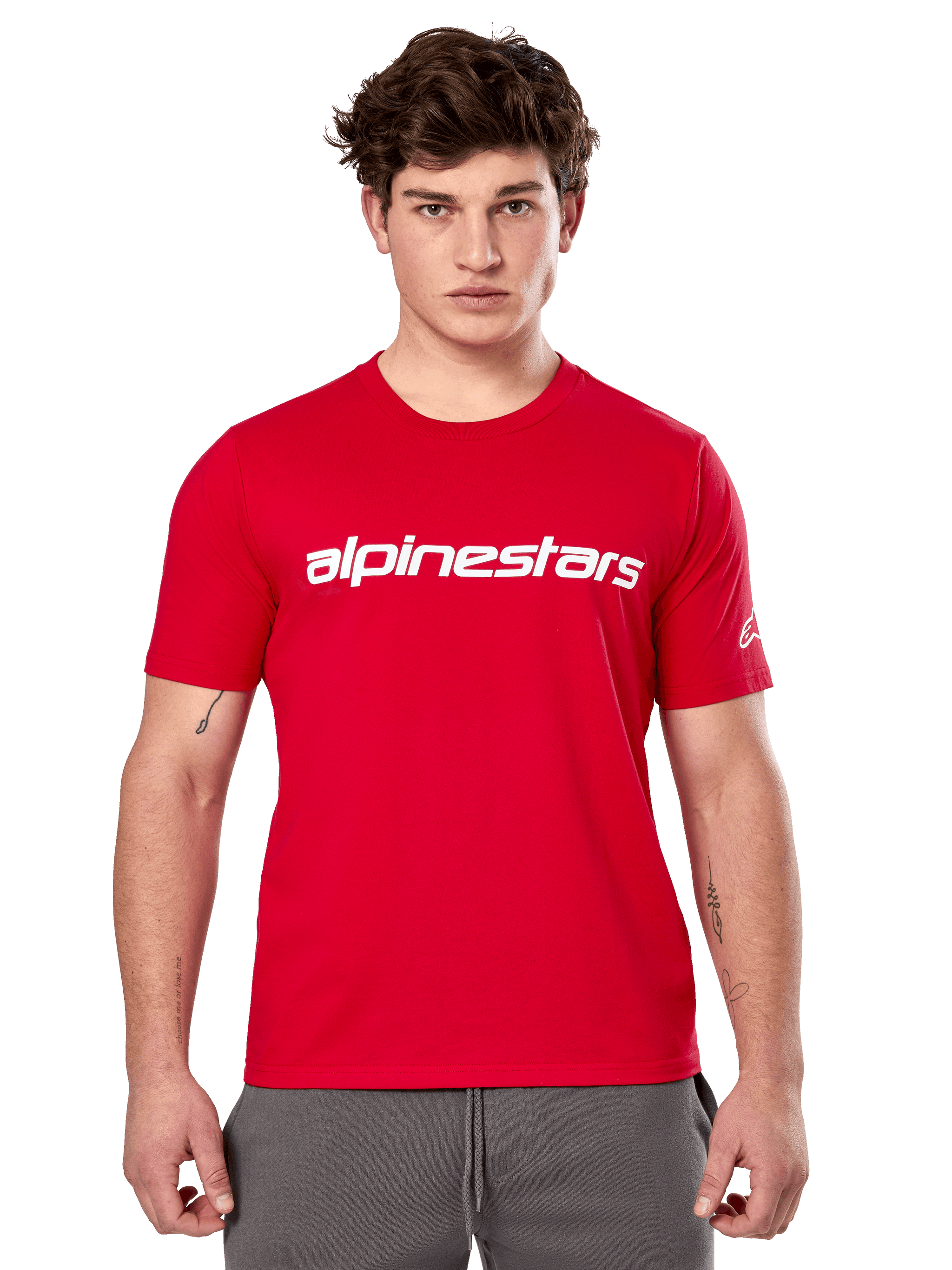 Alpinestars Linear Wordmark 2.0 CSF Tee, Short Sleeve T-Shirt, Red, White linear wordmark on chest and Ageless logo on sleeve, worn by male model with gray sweatpants, casual motorsport-inspired streetwear