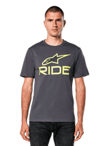 Alpinestars Ride 4.0 CSF Tee, Short Sleeve T-Shirt, Charcoal with Lime Yellow Astars and Ride logo, casual motorsport streetwear, worn by a model with dark jeans against a white background