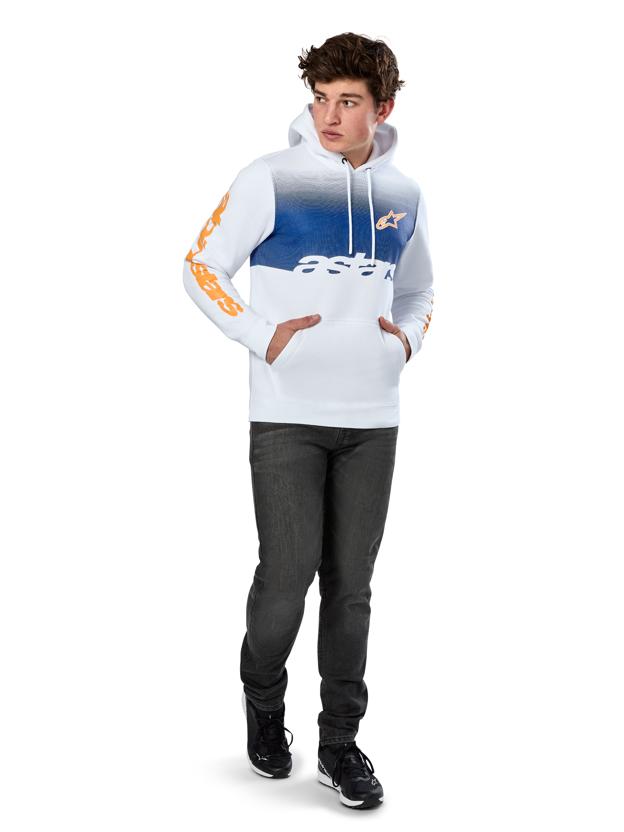 Alpinestars Specter Hoodie, White pullover fleece with blue gradation fade print, orange HD front logo and sleeve wordmarks, featuring a kangaroo pocket and drawstring hood, worn with dark jeans for a casual motorsport-inspired look