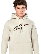 Alpinestars Insignia Hoodie, casual pullover sweatshirt, Off White with carbon fiber look logo on chest, red outline detail, drawstring hood and kangaroo pocket, worn by model, motorsport-inspired design