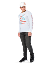 Alpinestars Ayess CSF Tee, Long Sleeve T-Shirt, White, featuring large blue and red CSF racing graphics on the chest and red Alpinestars branding on the sleeve, worn with dark jeans and a white Alpinestars cap, casual motorsport streetwear
