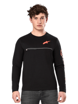 Alpinestars Committed CSF Long Sleeve Tee, Black, male model wearing casual long-sleeve shirt with orange Astars logo on chest, white line detail, and bold orange sleeve graphics, paired with dark grey jeans