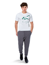 Alpinestars Geografica CSF Tee, Short Sleeve T-Shirt, White, Green Astars Logo with geographic multi-tech graphic, worn with grey sweatpants and black sneakers, casual motorsport streetwear