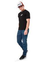 Alpinestars Formulate Csf Tee, Short Sleeve T-Shirt, Black with white Astars chest logo, worn by a model with blue jeans, a burgundy and white cap, and black sneakers, casual motorsport-inspired streetwear