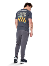 Alpinestars No Barrier CSF Tee, Short Sleeve T-Shirt, Charcoal, Back view featuring large distressed photo graphic with yellow diagonal stripes and white logo, casual motorsport-inspired streetwear