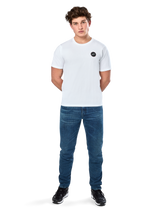 Alpinestars Dot Carbon Csf Tee, Short Sleeve T-Shirt, White, Circular Astars Logo with carbon fiber look, Casual Motorsport Streetwear, worn by a male model with blue jeans and black sneakers