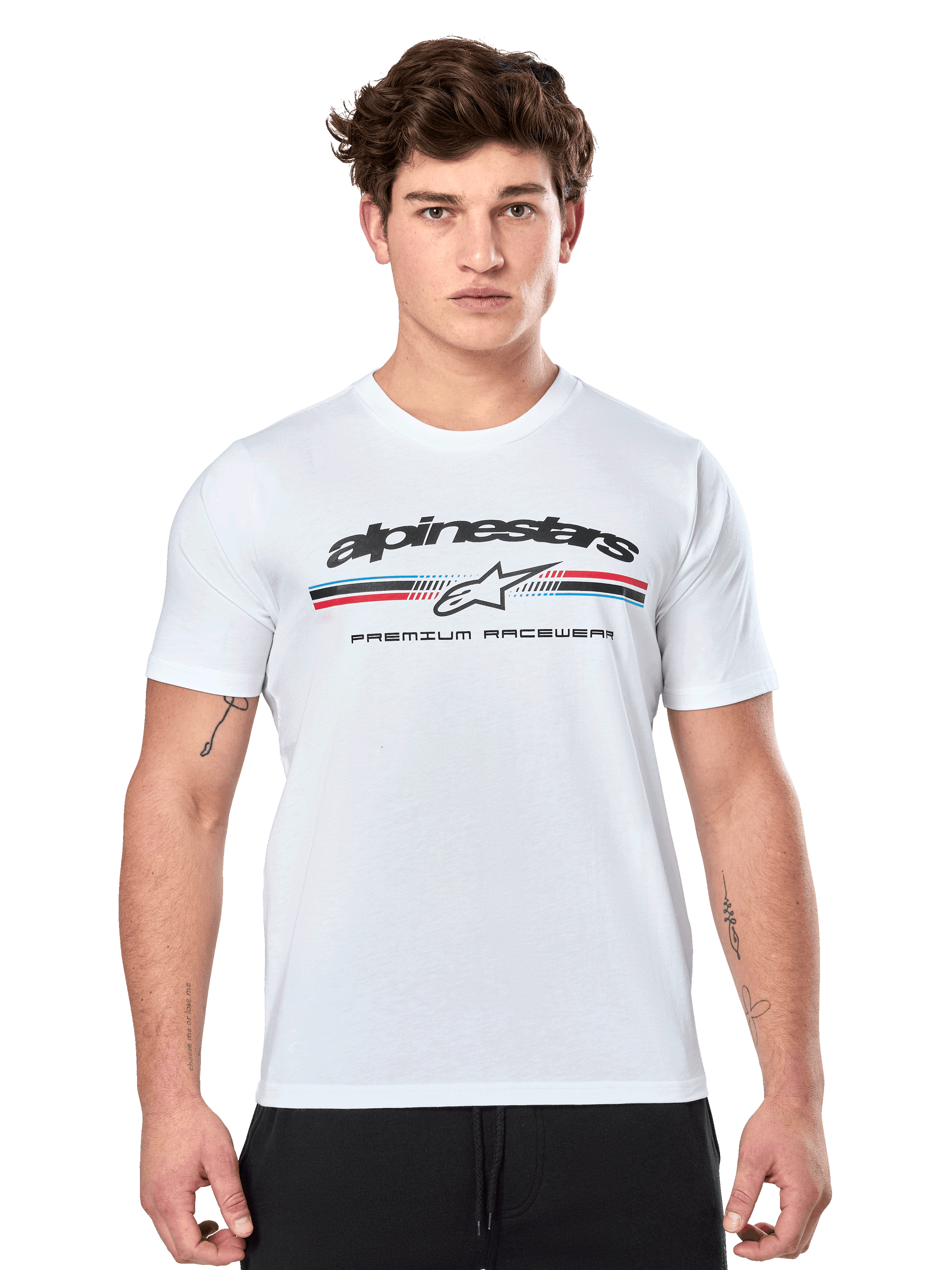 Alpinestars Prevail CSF Tee, White Short Sleeve T-Shirt, featuring a front paddock-style tri-color stripe logo with red and blue accents, black Alpinestars branding, and 'Premium Racewear' text, worn by a male model, casual motorsport apparel