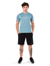 Alpinestars Point Performance Tee, Short Sleeve T-Shirt, Ice Blue, featuring a small black front logo, crew neck, worn by a model with black shorts and black sneakers, casual moisture-wicking sportswear