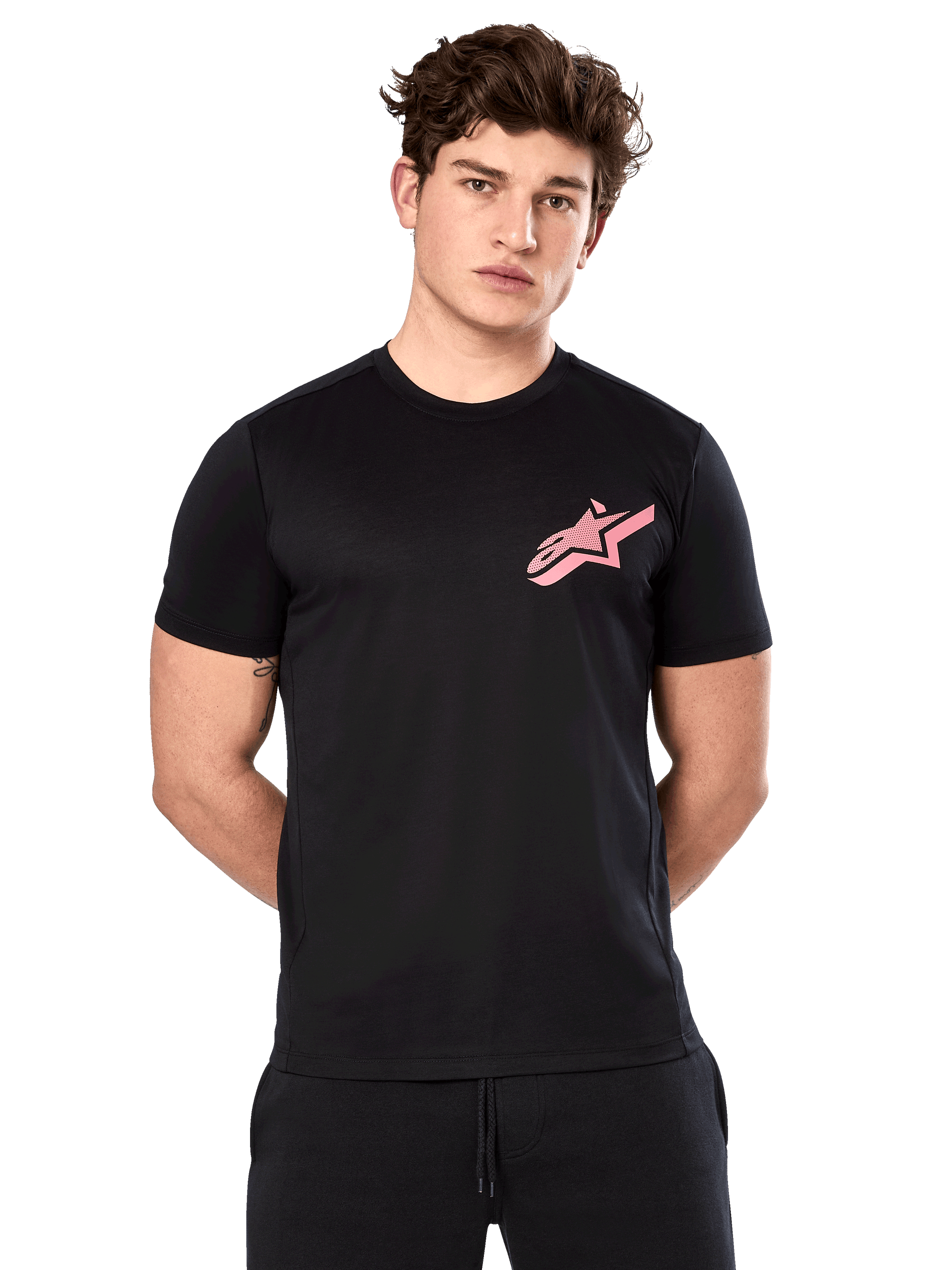 Alpinestars Attrition Performance Tee, Short Sleeve T-Shirt, Black with Pink Astars Logo on chest, worn by male model, Casual Motorsport Performance Wear