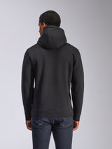 Alpinestars Blaze V3 Hoodie, rear view of black pullover fleece hoodie, casual streetwear, featuring ribbed cuffs and hem, jersey-lined hood, worn with dark blue jeans