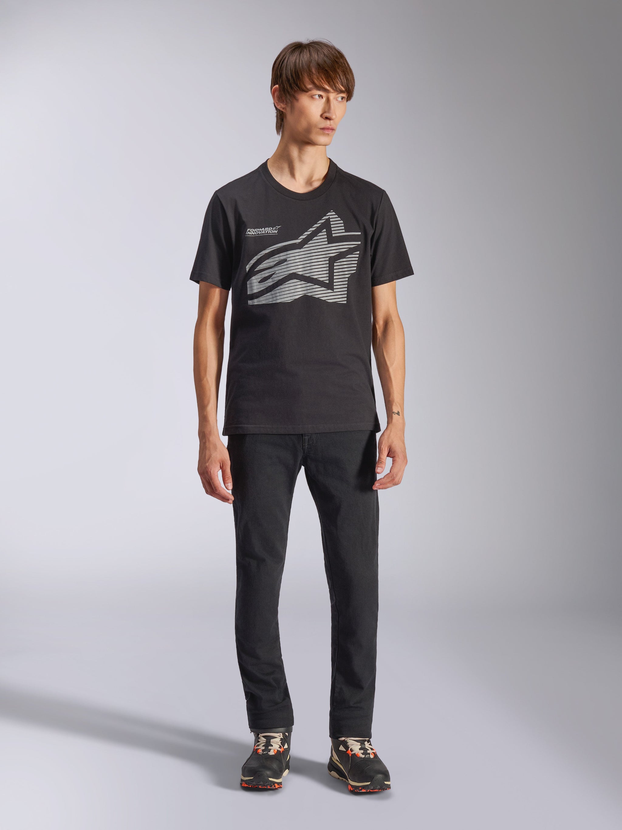 Alpinestars Fasting CSF Tee, Short Sleeve T-Shirt, Black, Large Gray Geometric Astars Logo, worn by model with black pants and sneakers, casual motorsport streetwear