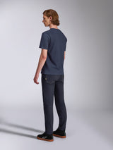 Alpinestars Fasting CSF Tee, Short Sleeve T-Shirt, Navy Blue, back view on model, paired with dark denim pants and black sneakers, casual motorsport-inspired streetwear