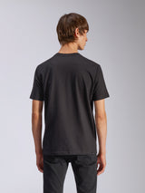 Alpinestars Harken CSF Tee, Short Sleeve T-Shirt, Black, back view of model wearing casual motorsport-inspired streetwear, simple black design, short sleeves, paired with black pants