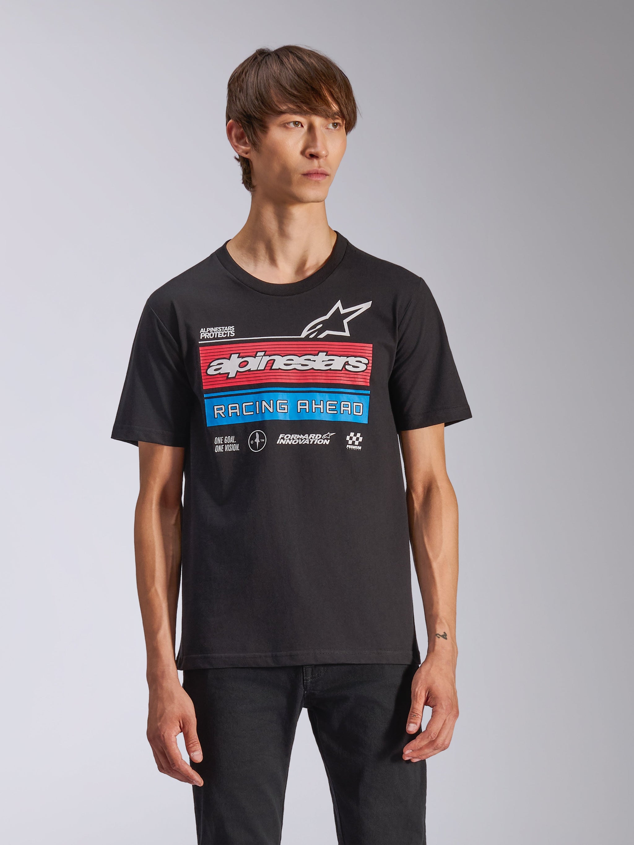 Alpinestars Harken CSF Tee, Short Sleeve T-Shirt, Black, featuring a large chest graphic with red and blue horizontal bars, 'alpinestars' and 'RACING AHEAD' text, and white star logo, casual motorsport streetwear