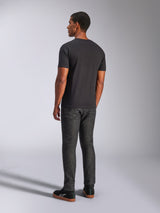 Alpinestars Heritage Patch CSF Tee, Short Sleeve T-Shirt, Black, back view on model, casual motorsport streetwear, paired with dark denim jeans and black sneakers