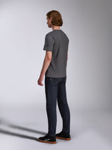 Alpinestars Waving CSF Tee, Short Sleeve T-Shirt, Charcoal, back-side view on model, small black star logo on sleeve, worn with dark denim jeans and black sneakers, casual motorsport streetwear