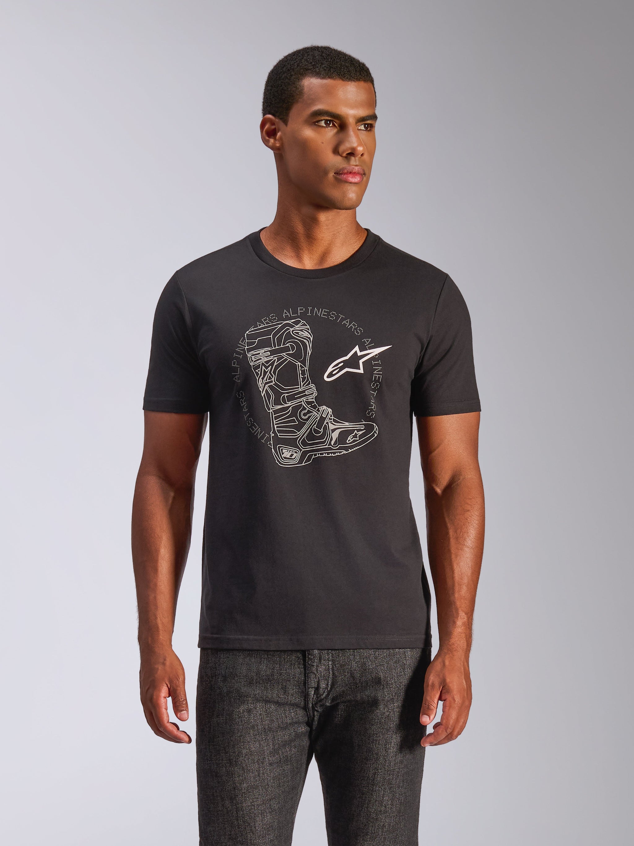 Alpinestars Tech Boot CSF T-Shirt, Black Cotton Tee with White Motocross Boot and Star Logo, worn by model, Sportswear