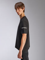 Alpinestars Frontal CSF Tee, Short Sleeve T-Shirt, Black, white Alpinestars logo on sleeve, worn by model in profile view, casual motorsport performance streetwear