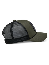 Alpinestars Booted Trucker Hat, Military Green with Black mesh back, side view showing curved bill and braided rope trim, casual motorsport-inspired headwear