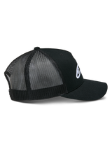 Alpinestars Ageless Trucker Hat, Black, side view showing structured crown and white embroidered Astars logo, curved bill, and breathable black poly mesh back panels.