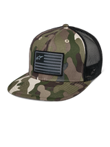 Alpinestars Flag Flat Trucker Hat, green camouflage and black, flat bill trucker cap with breathable mesh back, structured crown featuring a black flag-style logo patch, casual motorsport headwear.