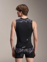 Alpinestars A-Motion Plasma Protection Vest, Black Camo, back view on male model, featuring breathable mesh construction with an integrated Nucleon Plasma back protector, grey camouflage accents on the shoulders and waist, and Alpinestars branding.