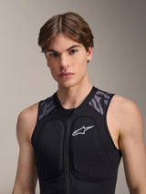 Alpinestars A-Motion Plasma Protection Vest, Black Camo, worn by a male model, featuring a white chest logo and grey camo shoulder panels, front zipper design with integrated padding for MTB protection