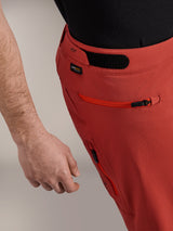 Alpinestars A-Dura Elite Shorts, Dark Orange, close-up of side profile featuring hook and loop waist adjuster, Cordura® logo, and zippered side pocket, premium mountain bike shorts.