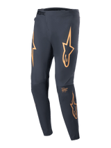 Alpinestars A-Supra Race Pants, MTB Racing Pants, Black with prominent orange star logos on the thighs, featuring a front ratchet closure, laser-perforated ventilation, and a tapered athletic fit.