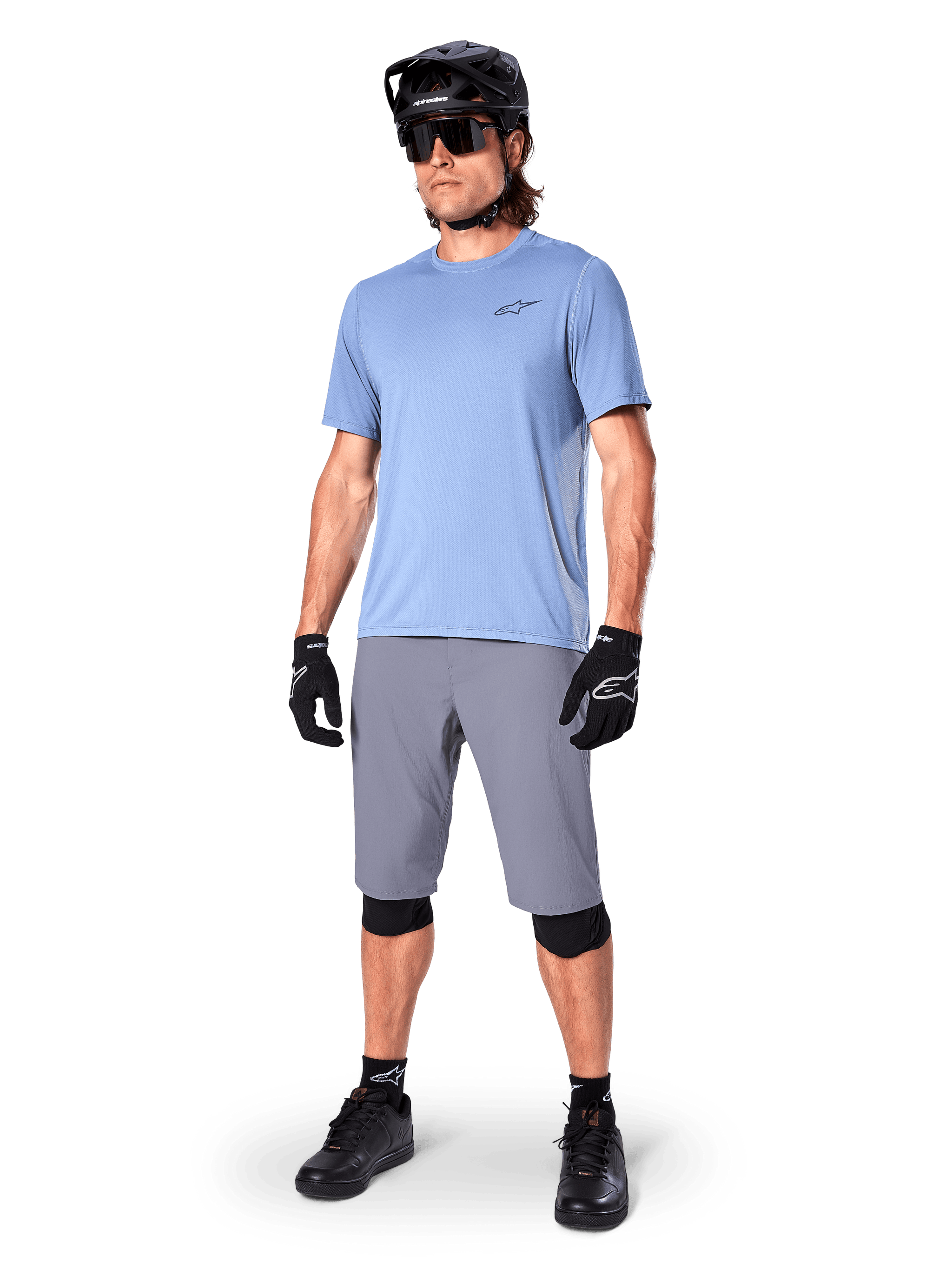 Alpinestars A-Dura Shorts, MTB Shorts, Dark Gray, worn by a rider with a light blue jersey, black MTB helmet, black gloves, and knee guards, complete mountain bike outfit for trail and off-road riding