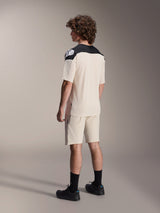 Alpinestars A-Aria Elite Shorts and matching Jersey, Mountain Bike Apparel, Ecru with black accents, male model shown from the back wearing black socks and shoes, performance off-road cycling gear