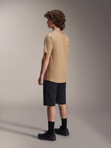 Alpinestars A-Dura Shorts, Mountain Bike Shorts, Black, paired with a tan A-Dura short-sleeve jersey and black riding shoes, featuring a regular fit and durable construction for off-road cycling, rear-side view