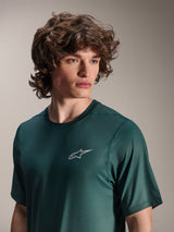 Alpinestars A-Dura Rise Jersey - Short Sleeve, Silver Pine green, worn by a model, small white Astars logo on chest, jacquard performance fabric, casual mountain bike apparel