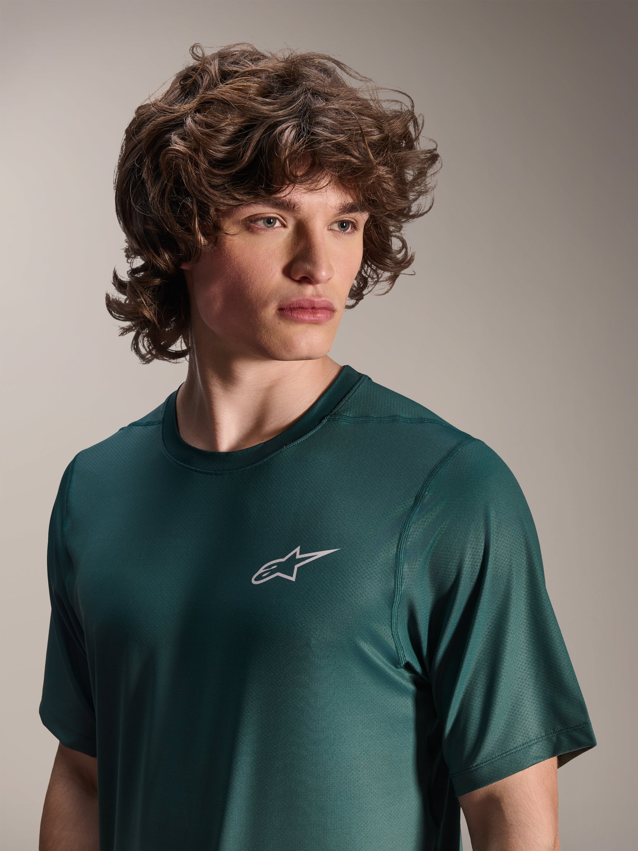Alpinestars A-Dura Rise Jersey - Short Sleeve, Silver Pine green, worn by a model, small white Astars logo on chest, jacquard performance fabric, casual mountain bike apparel