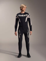 Alpinestars A-Supra Melt Jersey, Long Sleeve MTB Jersey, Black with white Astars branding across the chest, worn with matching black mountain bike pants featuring star logos, sleek performance cycling gear