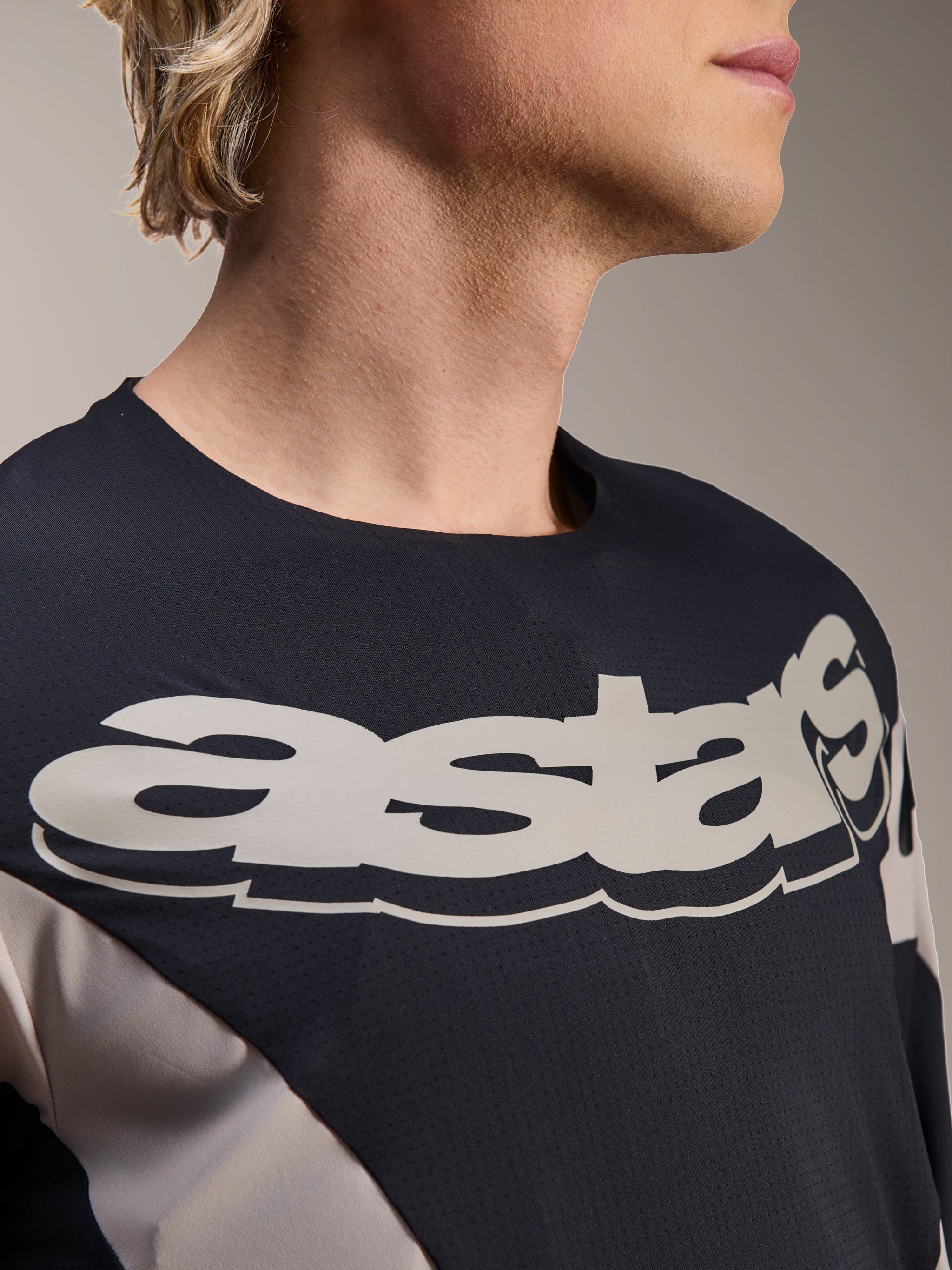 Alpinestars A-Supra Melt Jersey, Long Sleeve MTB Jersey, Black and Grey with large white astars wordmark on chest, micro-perforated breathable fabric, racing-inspired design