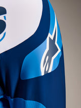 Alpinestars A-Supra Melt Jersey, Long Sleeve MTB Jersey in Blue, close-up of the sleeve showing the ASTARS logo graphic and micro-perforated fabric for ventilation