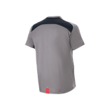 Alpinestars A-Dura Dri Astar Jersey, Short Sleeve Mountain Bike Jersey, Dark Gray, back view featuring black mesh ventilation panels across the shoulders and a small red tag at the hem, technical cycling gear