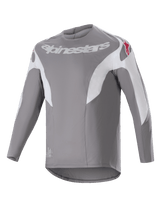 Alpinestars A-Supra Race Jersey, Long Sleeve MTB Jersey, Dark Gray with white paneling, featuring white Alpinestars logo on the chest and red star logos on shoulders, technical micro-perforated fabric with a dropped tail design for off-road cycling
