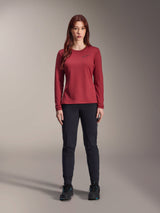 Alpinestars Stella A-Dura Thermal Pant, Women's MTB Pants, Black, worn with a maroon long-sleeve technical jersey, slim-fit thermal design for cold weather cycling, durable outer shell with brushed fleece lining
