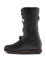 Alpinestars Tech-T Boots, trials motorcycle boots, Black with a thin red stripe on the sole, side profile view, featuring an ergonomic shinplate and textured panels for footpeg grip, durable leather construction for off-road riding