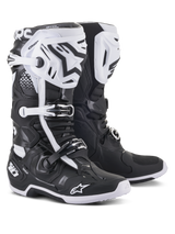 Alpinestars Tech 10 Motocross Boots, Black and White, high-performance protective design with white shin plates, black star logos, adjustable buckles, and DHCP heel protection, rugged textured soles for off-road racing