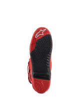 Alpinestars Tech 10 Boots, Red, Sole View, featuring a black replaceable central insert with micro-grip texture, white Alpinestars logo on the toe, durable rubber construction for motocross racing