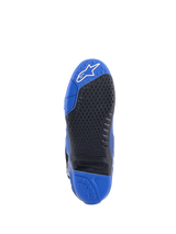 Alpinestars Tech 10 Boots, Blue and Black, detailed view of the sole, featuring a textured black grip pattern with a replaceable central insert, blue toe with white logo, and blue heel, high-performance motocross boot design