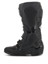 Alpinestars Tech 7 Enduro Drystar® Boots, Black, side profile view showing the medial side with textured honeycomb grip panels and the '7' logo, waterproof off-road motorcycle footwear for enduro racing.