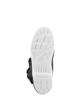 Alpinestars Tech 3 Enduro Waterproof Boots, Black and White, bottom view of the white high-grip lugged sole, off-road traction pattern with embossed logo, durable outsole designed for motocross and enduro performance.